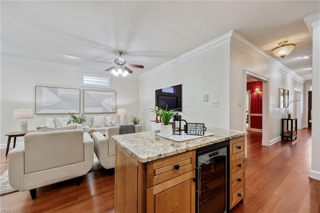623 London St, Portsmouth, VA 23704 - kitchen featuring wine cooler, dark wood-style floors, brown cabinetry, ceiling fan, and ornamental molding