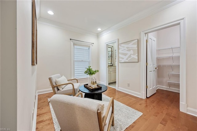 623 London St, Portsmouth, VA 23704 - living area with crown molding, light wood finished floors, and recessed lighting