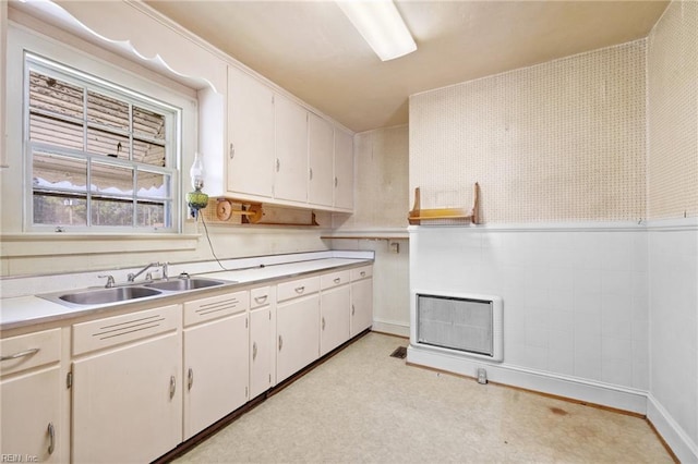 1132 Proctor St, Suffolk, VA 23434 - kitchen featuring light countertops, white cabinets, and light floors