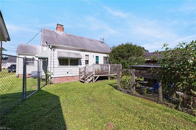 1132 Proctor St, Suffolk, VA 23434 - rear view of house with a chimney, a deck, and a shingled roof