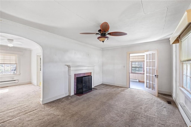 1132 Proctor St, Suffolk, VA 23434 - unfurnished living room featuring a ceiling fan, carpet flooring, a baseboard radiator, a brick fireplace, and ornamental molding