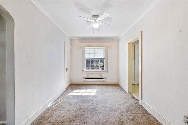 1132 Proctor St, Suffolk, VA 23434 - spare room with arched walkways, a baseboard heating unit, ornamental molding, a ceiling fan, and carpet flooring