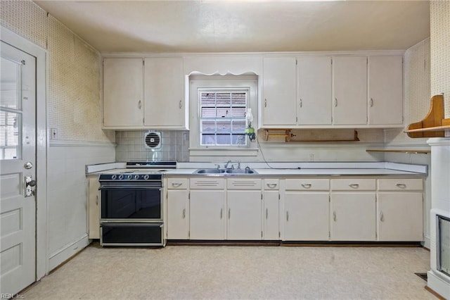 1132 Proctor St, Suffolk, VA 23434 - kitchen featuring range, light countertops, light flooring, and white cabinets