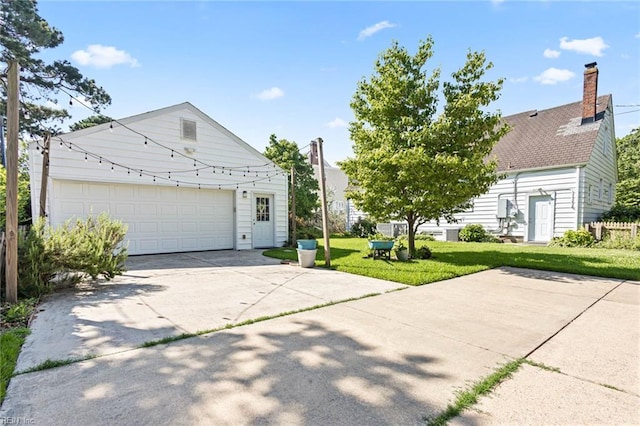 414 Russell St, Portsmouth, VA 23707 - view of front of home featuring a front lawn, concrete driveway, and a chimney