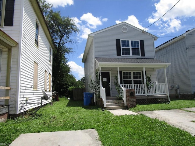 1314 18th St, Chesapeake, VA 23324 - view of front of house featuring a porch and a front yard