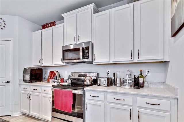145 Blessing Cir, Suffolk, VA 23434 - kitchen featuring appliances with stainless steel finishes, white cabinetry, and light wood-style flooring
