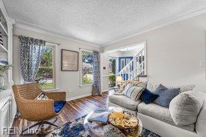 1879 Eastborne Dr, Virginia Beach, VA 23454 - living area featuring ornamental molding, a textured ceiling, and wood finished floors