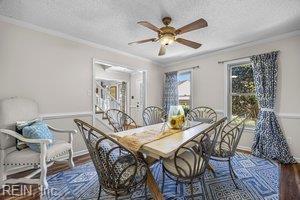 1879 Eastborne Dr, Virginia Beach, VA 23454 - dining room featuring a textured ceiling, ornamental molding, wood finished floors, and a ceiling fan