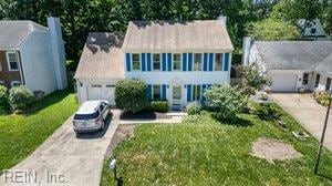 1879 Eastborne Dr, Virginia Beach, VA 23454 - colonial house featuring driveway, an attached garage, and a front yard