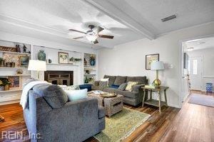 1879 Eastborne Dr, Virginia Beach, VA 23454 - living area with wood finished floors, ceiling fan, a fireplace, and beam ceiling