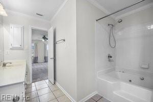 1879 Eastborne Dr, Virginia Beach, VA 23454 - bathroom featuring tile patterned floors, ornamental molding, vanity, shower / bathtub combination, and ceiling fan