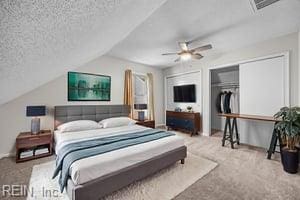 1879 Eastborne Dr, Virginia Beach, VA 23454 - bedroom featuring carpet, lofted ceiling, a ceiling fan, and a textured ceiling