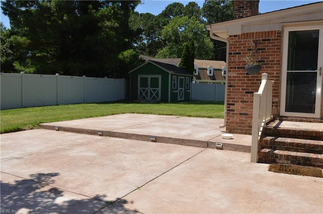 301 Woodbridge Dr, Chesapeake, VA 23322 - fenced backyard with a patio area, a storage shed, and entry steps