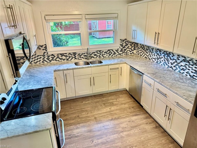 613 N Shore Rd, Norfolk, VA 23505 - kitchen with stainless steel appliances, light wood-style floors, tasteful backsplash, white cabinetry, and light stone countertops