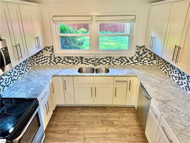 613 N Shore Rd, Norfolk, VA 23505 - kitchen featuring appliances with stainless steel finishes, light wood-style floors, backsplash, and light stone countertops