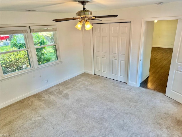 613 N Shore Rd, Norfolk, VA 23505 - unfurnished bedroom featuring carpet floors, a closet, and a ceiling fan