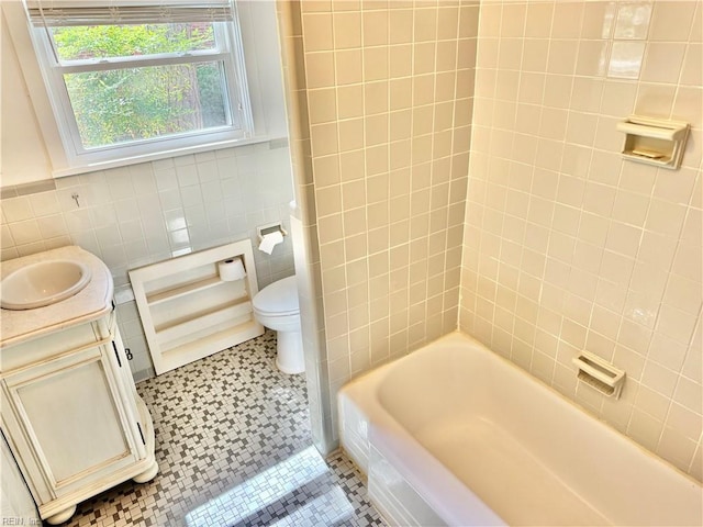 613 N Shore Rd, Norfolk, VA 23505 - bathroom featuring tile walls, vanity, and shower / bath combination