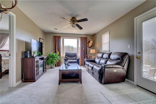 215 Lisbon Dr, Newport News, VA 23601 - living area with a ceiling fan and light colored carpet