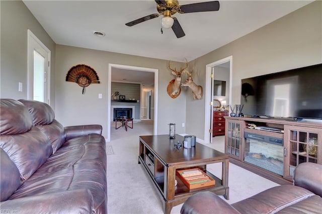 215 Lisbon Dr, Newport News, VA 23601 - carpeted living room with a ceiling fan and a glass covered fireplace