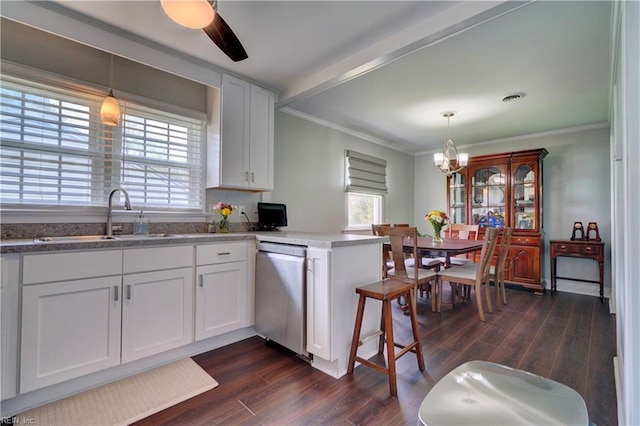 215 Lisbon Dr, Newport News, VA 23601 - kitchen featuring stainless steel dishwasher, a chandelier, crown molding, dark wood-type flooring, and white cabinets