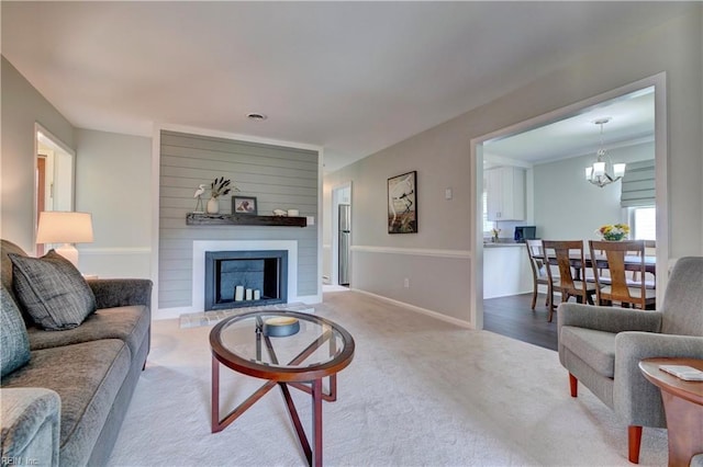 215 Lisbon Dr, Newport News, VA 23601 - carpeted living area featuring a chandelier and a large fireplace