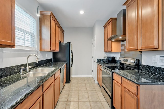 923 Hill St, Chesapeake, VA 23324 - kitchen featuring stainless steel appliances, wall chimney range hood, brown cabinetry, dark stone counters, and recessed lighting