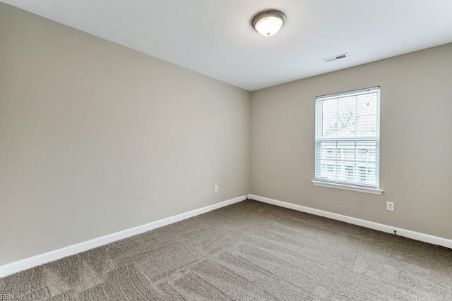 923 Hill St, Chesapeake, VA 23324 - empty room with dark colored carpet and baseboards
