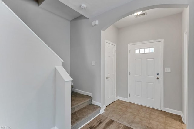 923 Hill St, Chesapeake, VA 23324 - entryway with arched walkways, stairs, and light wood-style flooring