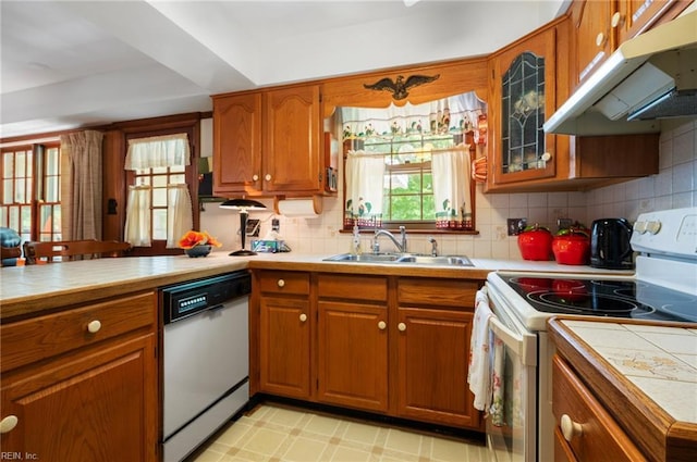 440 N Adventure Trl, Virginia Beach, VA 23454 - kitchen featuring white appliances, under cabinet range hood, brown cabinets, and tile counters