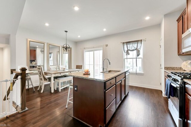 1803 Yardarm Way, Chesapeake, VA 23323 - kitchen with stainless steel appliances, dark wood-style floors, a kitchen island with sink, light stone countertops, and recessed lighting