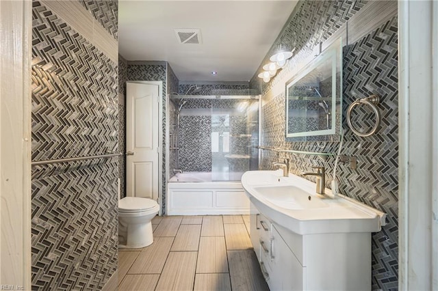 556 Summers Dr, Norfolk, VA 23509 - bathroom featuring vanity and combined bath / shower with glass door