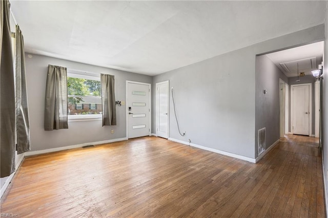 556 Summers Dr, Norfolk, VA 23509 - unfurnished room with attic access and hardwood / wood-style floors