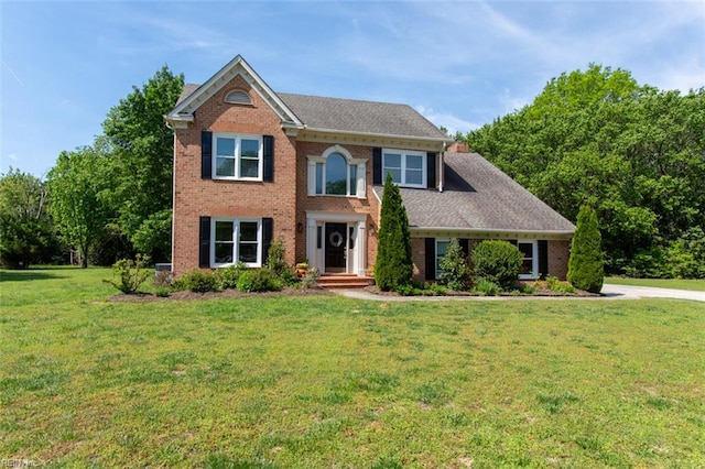 108 Sunrise Bluff Ct, Smithfield, VA 23430 - colonial home with a front lawn and brick siding