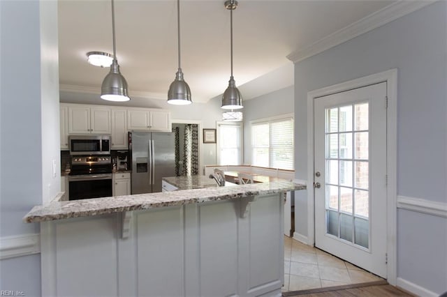 108 Sunrise Bluff Ct, Smithfield, VA 23430 - kitchen with stainless steel appliances, a breakfast bar area, white cabinetry, crown molding, and light stone countertops
