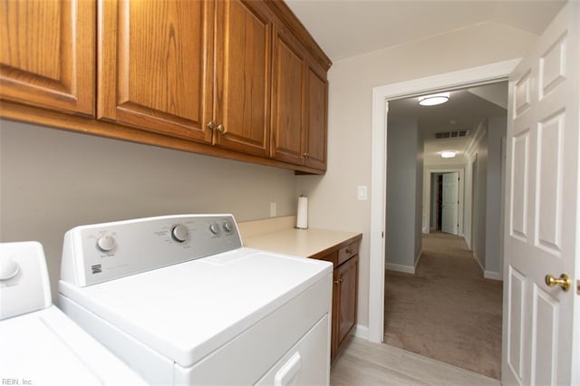 108 Sunrise Bluff Ct, Smithfield, VA 23430 - washroom featuring cabinet space, separate washer and dryer, and light colored carpet