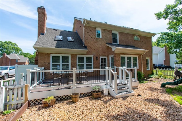 108 Sunrise Bluff Ct, Smithfield, VA 23430 - back of property with brick siding, a chimney, and a deck