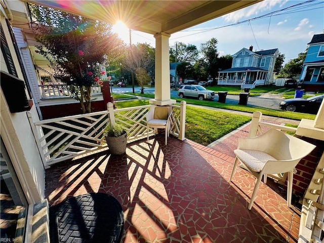1204 Holly Ave, Chesapeake, VA 23324 - covered porch featuring a yard