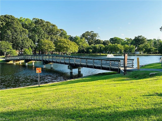 1204 Holly Ave, Chesapeake, VA 23324 - dock featuring a yard, a water view, and view of wooded area
