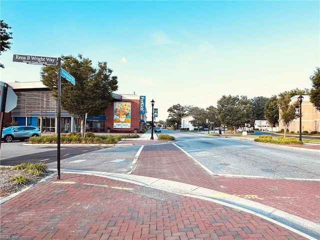 1204 Holly Ave, Chesapeake, VA 23324 - view of decorative road featuring sidewalks, curbs, and street lights