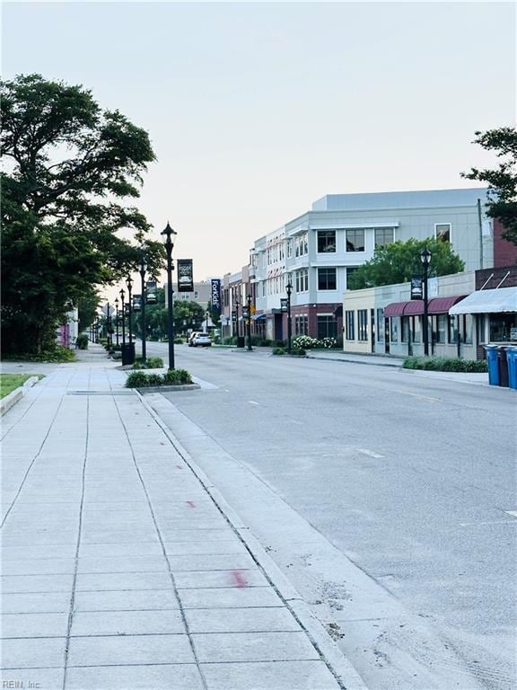 1204 Holly Ave, Chesapeake, VA 23324 - view of asphalt road with sidewalks, street lighting, and curbs