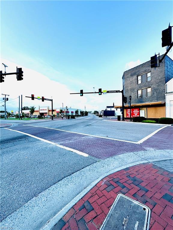 1204 Holly Ave, Chesapeake, VA 23324 - view of asphalt street with traffic lights, street lights, and sidewalks