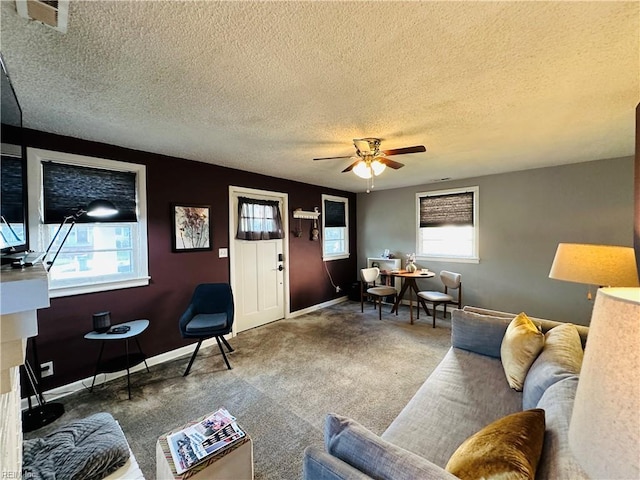 1204 Holly Ave, Chesapeake, VA 23324 - living room featuring a textured ceiling, ceiling fan, and carpet flooring