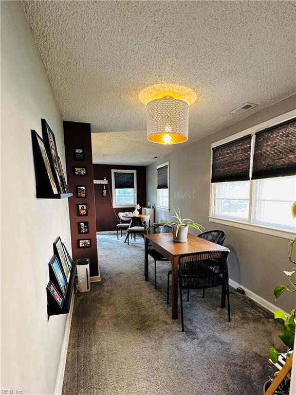 1204 Holly Ave, Chesapeake, VA 23324 - carpeted dining room with a textured ceiling and baseboards