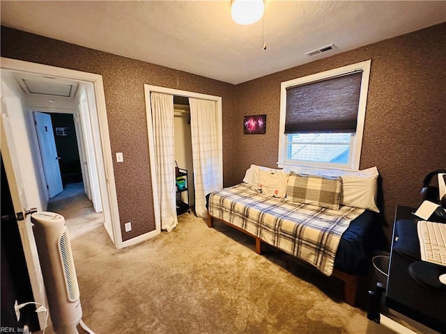 1204 Holly Ave, Chesapeake, VA 23324 - carpeted bedroom with a closet, a textured wall, and attic access
