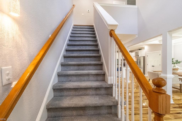 1161 Bells Mill Rd, Chesapeake, VA 23322 - stairway featuring wood finished floors and a towering ceiling