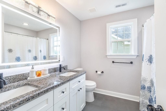 1161 Bells Mill Rd, Chesapeake, VA 23322 - bathroom featuring baseboards and double vanity
