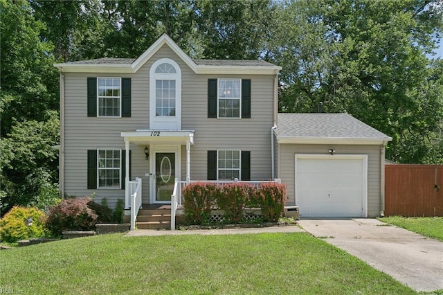 102 Saddle Dr, Newport News, VA 23602 - colonial home with driveway, an attached garage, and roof with shingles