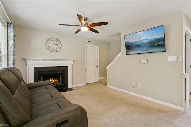 102 Saddle Dr, Newport News, VA 23602 - living area with a ceiling fan, carpet floors, a fireplace with flush hearth, and stairs