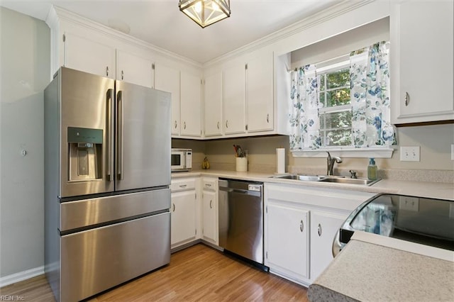 102 Saddle Dr, Newport News, VA 23602 - kitchen featuring stainless steel appliances, light countertops, light wood finished floors, and white cabinetry