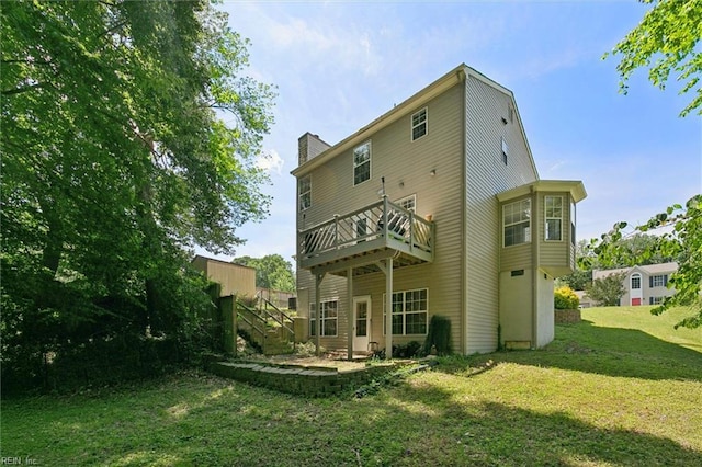 102 Saddle Dr, Newport News, VA 23602 - rear view of property with a lawn, a chimney, and a wooden deck